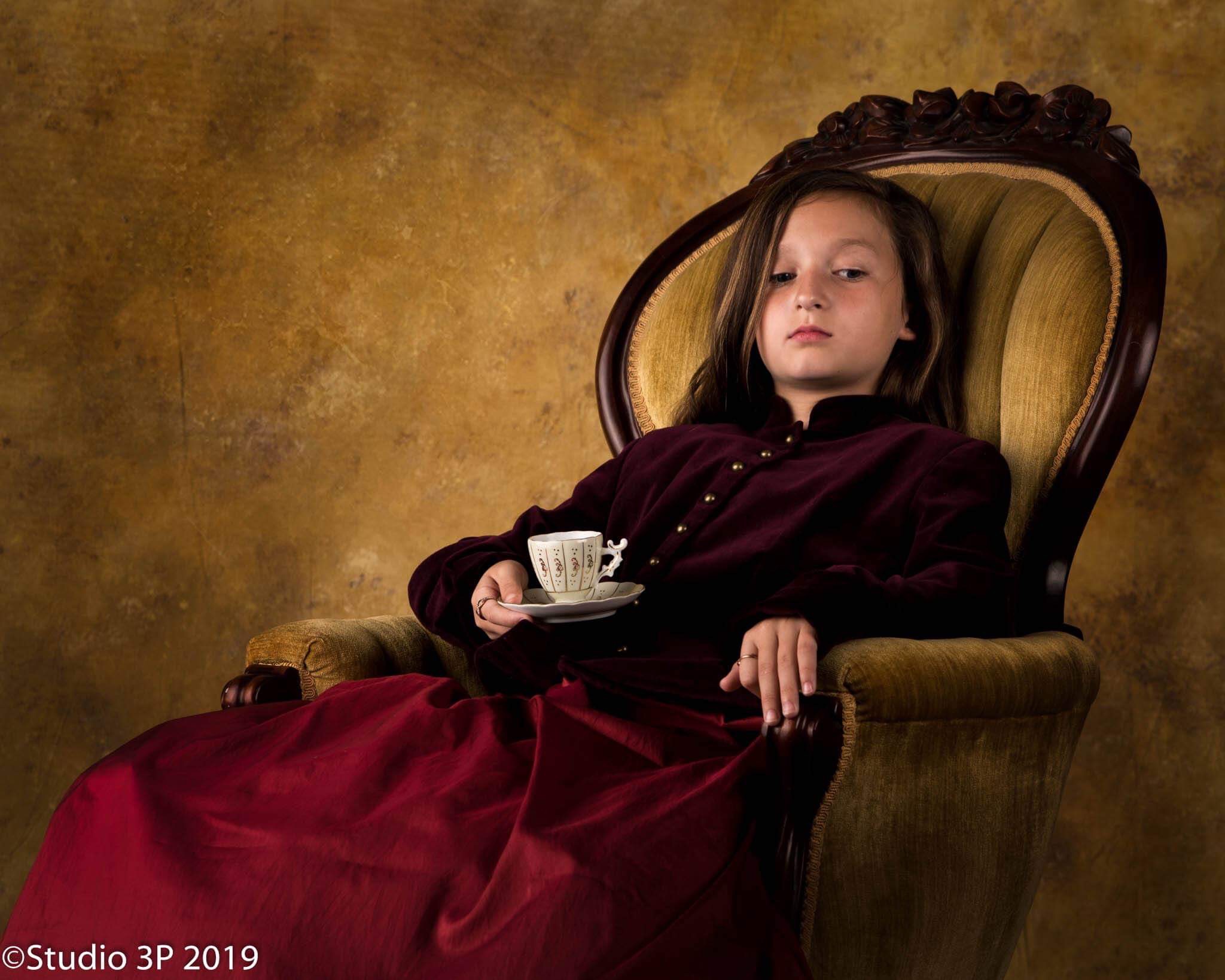 young girl sitting in a chair